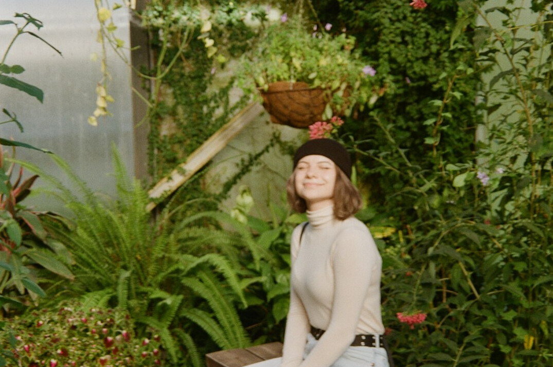 Portrait of a smiling woman in a garden